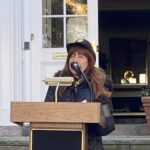 (PHOTO: Robin Latimer sings God Bless America at the Veterans Day ceremony on the Rye Village Green November 11, 2023.)