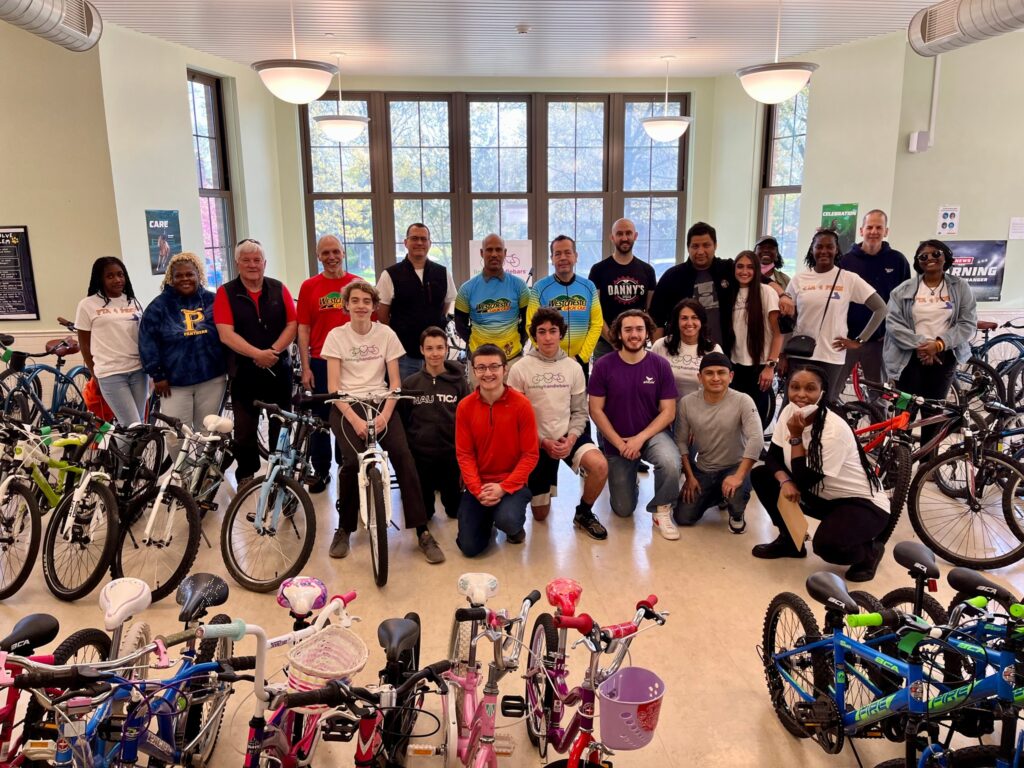 (PHOTO: A Linking Handlebars bike giveaway at Pennington Elementary School in Mt. Vernon with Linking Handlebars members, Westchester Cycle Club mechanics and the Pennington PTA.)