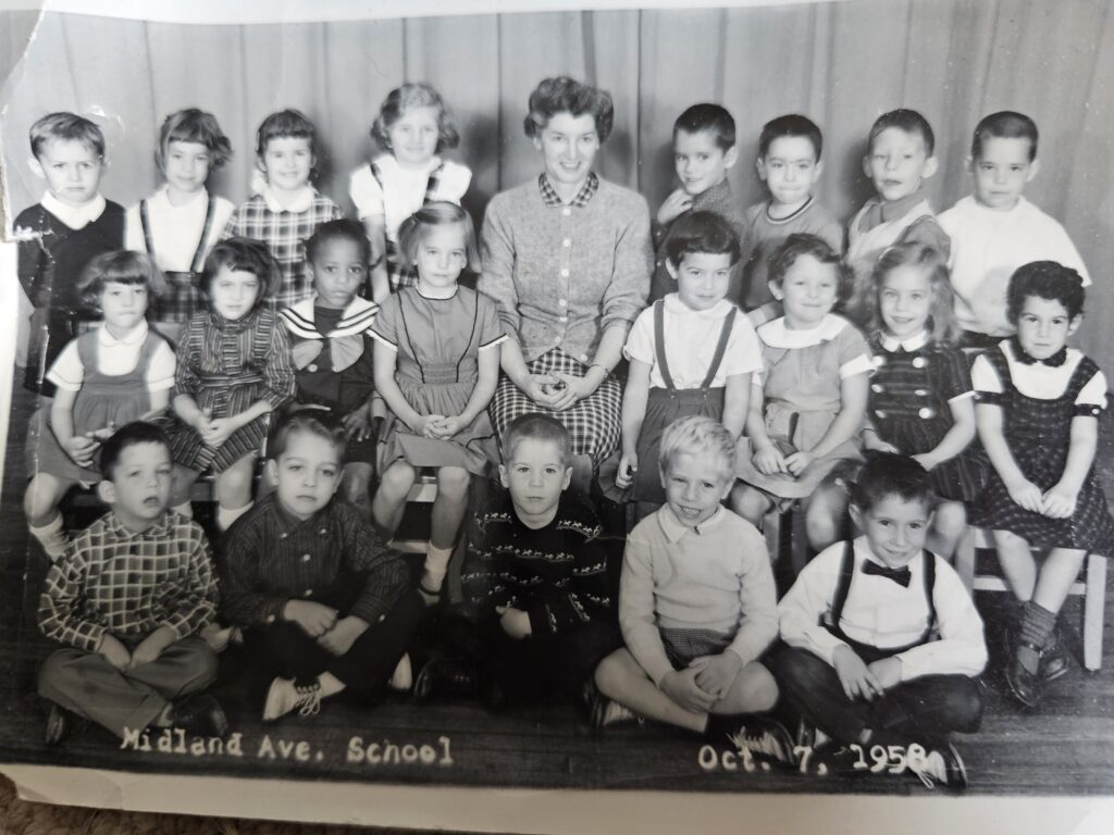 (PHOTO: Rye Lifer Robin Phelps Latimer and her Midland Elementary School kindergarten class.)