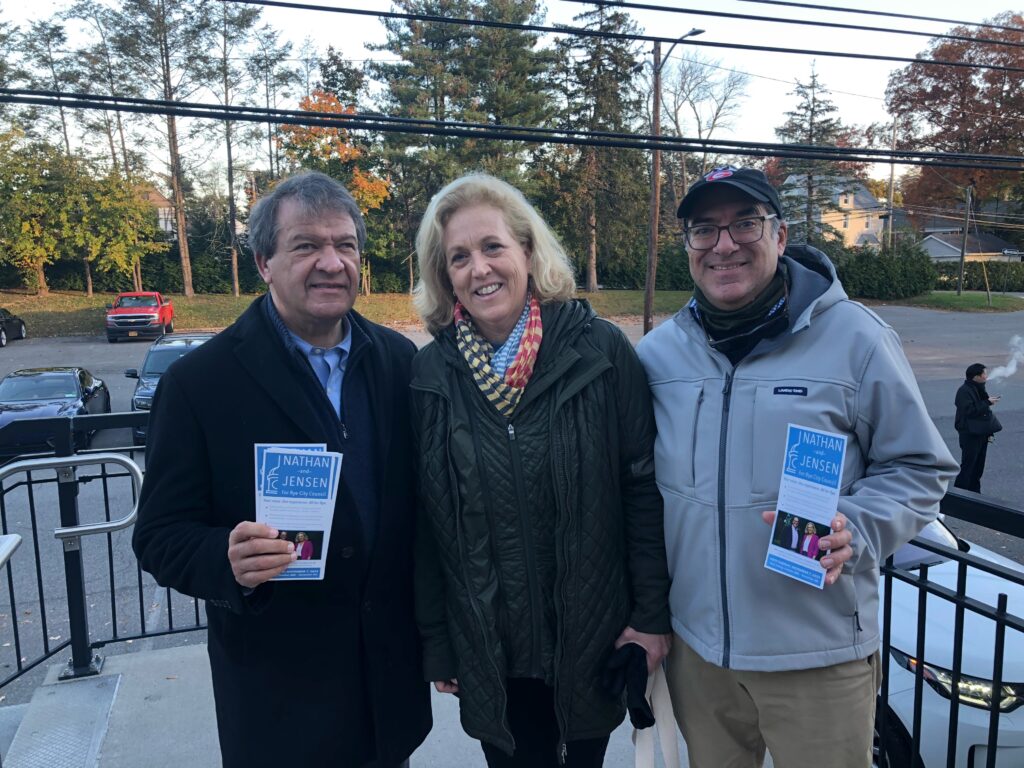 (PHOTO: Rye guy and County Executive George Latimer working the palm cards with City Council candidates Jamie Jensen (D-challenger) and Josh Nathan (D-incumbent) at the Harrison train station on Monday, November 6, 2023.)