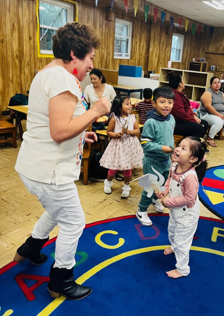 (PHOTO: Dancing fun with 5 Steps to Five Teacher Irma Arellano with Nathan and Nicole at All Souls Community Center in Port Chester during Summer 2023.)