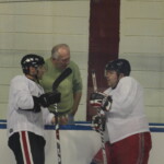 (PHOTO: Rye Lifer and Rye Boys Varsity Hockey Coach Peter Thomas, Former Coach John Zegras, Jay Altmeyer talking before the Coach Zegras Alumni game at Playland, December 2010.)