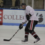 (PHOTO: Rye Lifer and Rye Boys Varsity Hockey Coach Peter Thomas looking to make a pass in the John Zegras Alumni game, December 2010.)