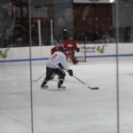 (PHOTO: Rye Lifer and Rye Boys Varsity Hockey Coach Peter Thomas taking a shot on goal in the John Zegras Alumni game, December 2010.)