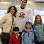 (PHOTO: Rye Lifer and Rye Boys Varsity Hockey Coach Peter Thomas with Pamela Thomas (wife) and Children-Lexi, Anabelle, and Bryan after Team White was victorious in the John Zegras Alumni game, December 2010.)