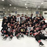 (PHOTO: Rye Boys Varsity Hockey Team after beating John Jay 5-1 in the 2019-2020 Section One Championship at Brewster Ice Arena, February 2020.)