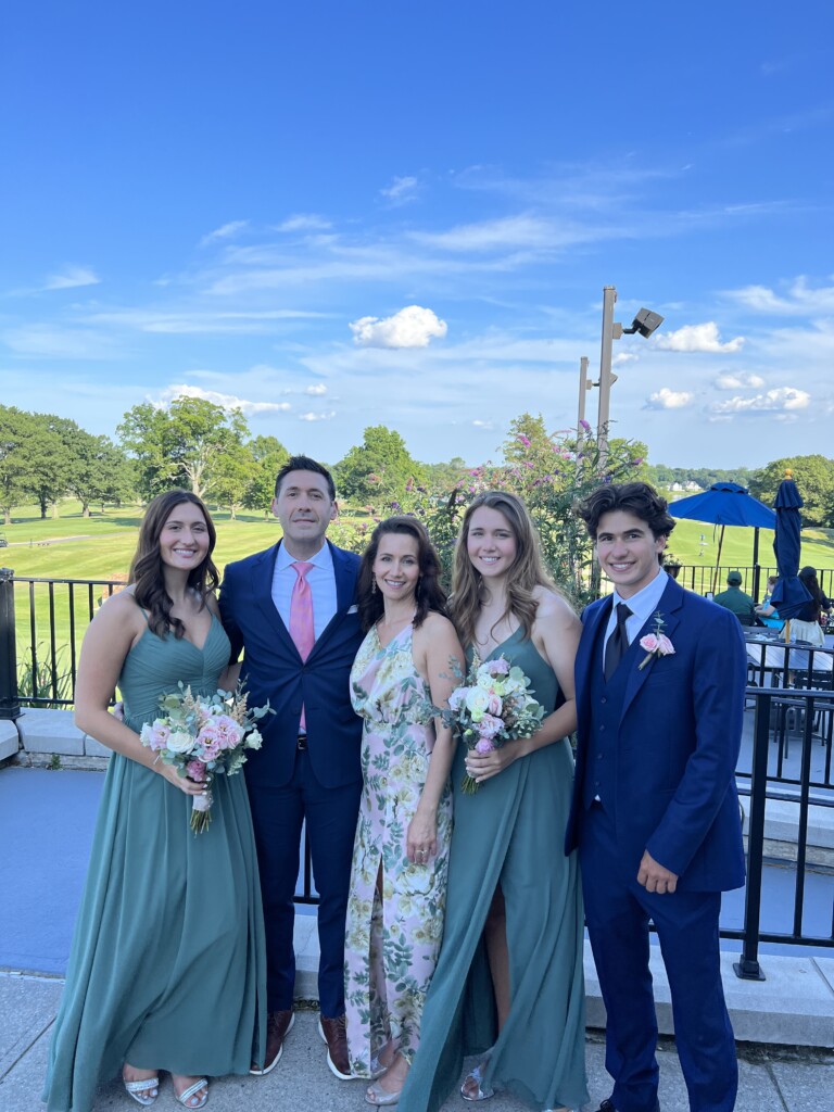 (PHOTO: Thomas family at nephew's wedding at Rye Golf Club, July 2022 (left to right): Lexi, Peter, Pamela, Anabelle, Bryan.)