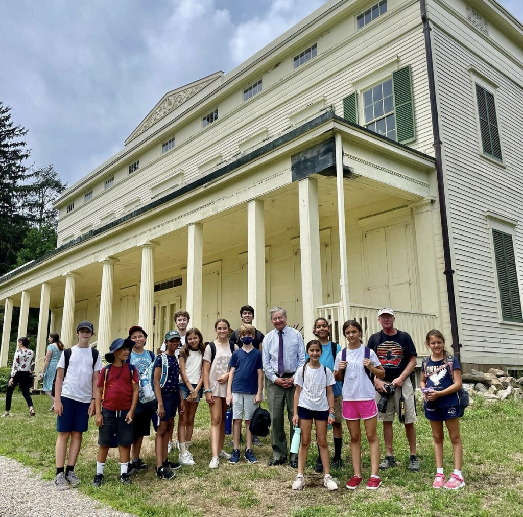 (PHOTO: Rye guy and New York State Assemblyman Steve Otis with students from the French American School at the Jay Estate.)