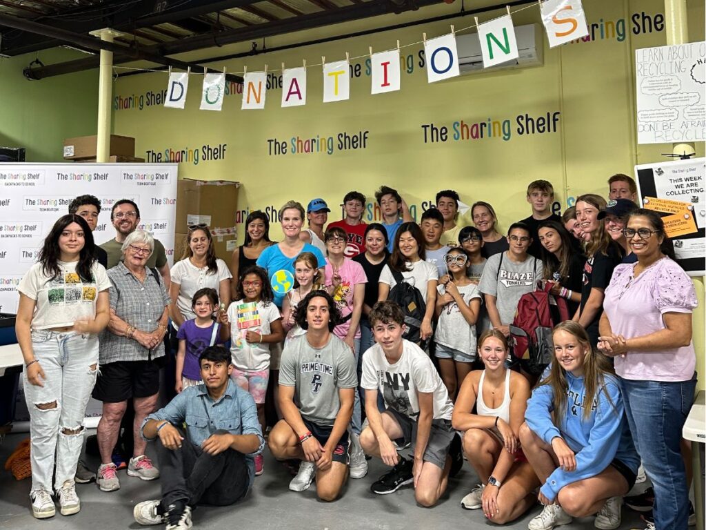(PHOTO: Summer backpack volunteers on The Sharing Shelf's Family Volunteer Day in August 2022.)