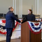 (PHOTO: Returning Councilmember Josh Nathan being sworn in by Judge Valerie Livingston at the City of Rye Inauguration Ceremony on Monday, January 1, 2024.)