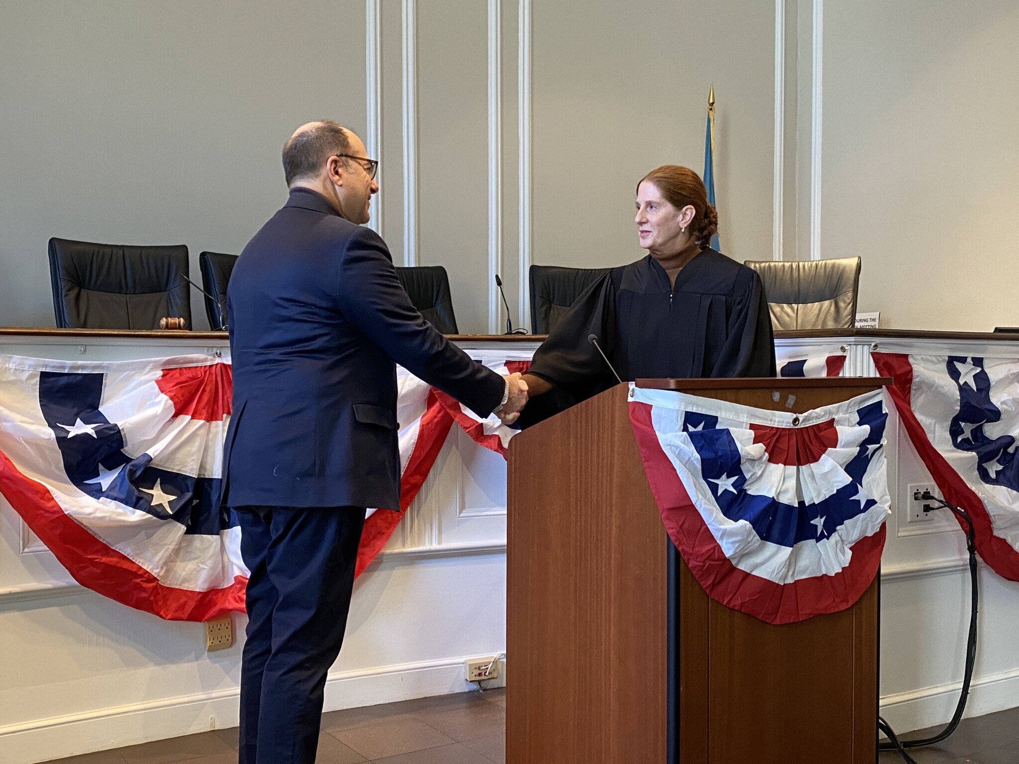 (PHOTO: Returning Councilmember Josh Nathan being sworn in by Judge Valerie Livingston at the City of Rye Inauguration Ceremony on Monday, January 1, 2024.)