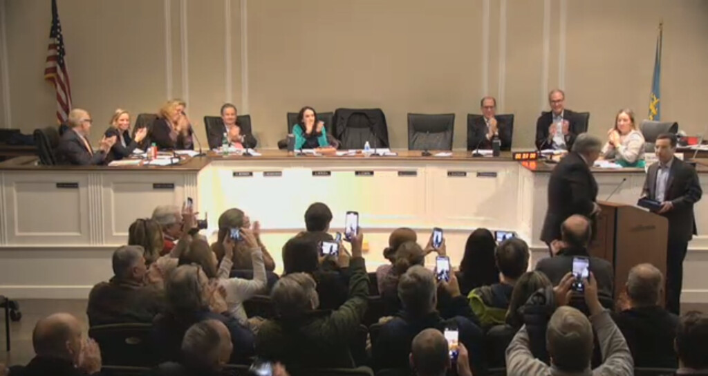 (PHOTO: Phones out! Residents packed City Council chambers to see Luke Walsh receive the Mayor John Carey Merit Award from Mayor Josh Cohn and the City of Rye on Wednesday, January 10, 2024.)