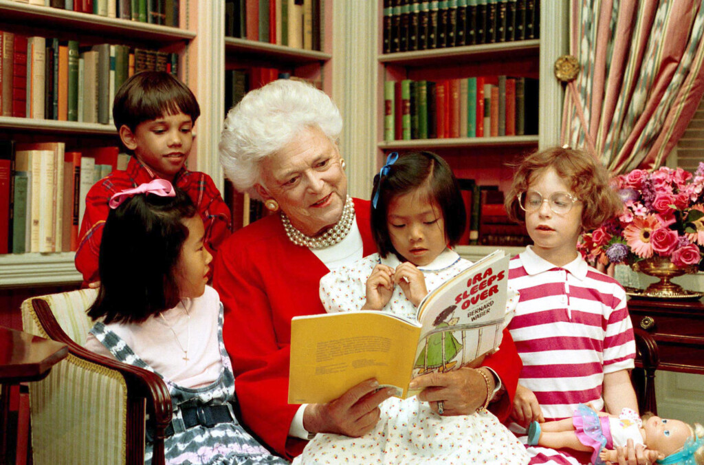 (PHOTO: First Lady Barbara Bush reads to children in the White House library, 1990. Credit: George H. W. Bush Presidential Photographs, 1/20/1989 - 1/20/1993 Collection: Records of the White House Photograph Office, 1/20/1989 - 1/20/1993.)