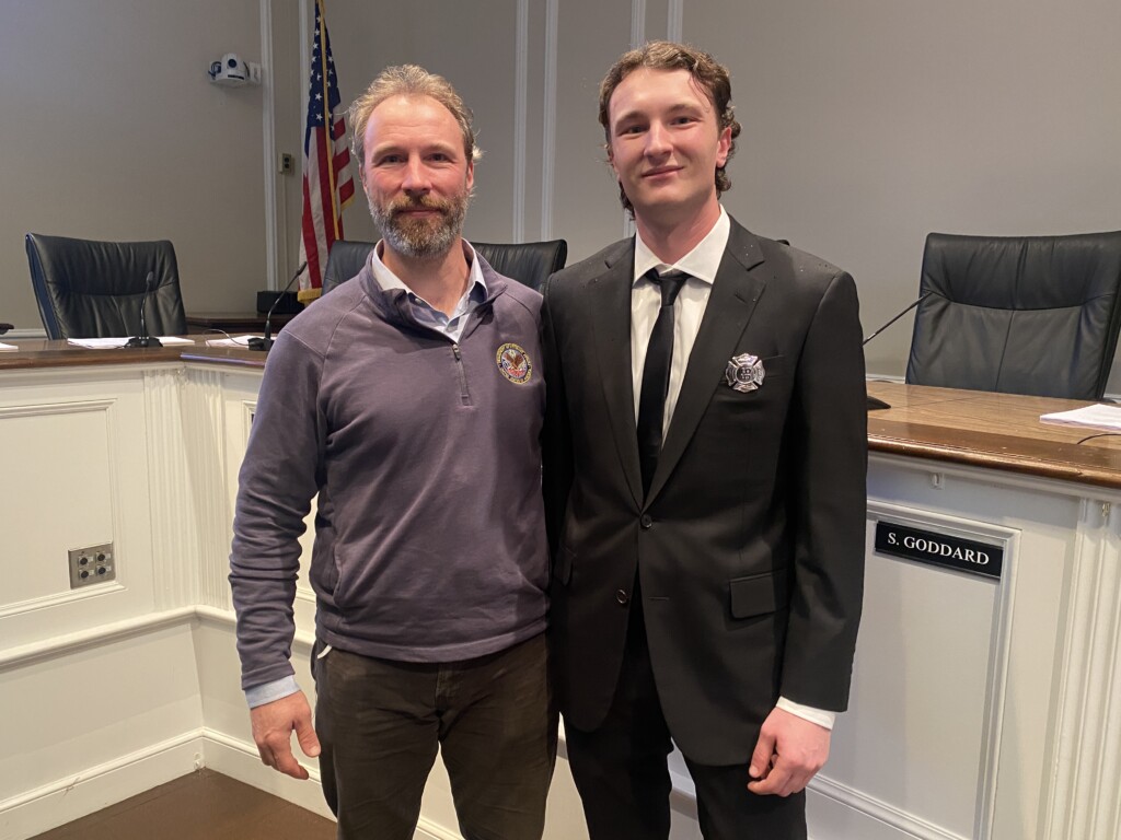 (PHOTO: New Rye FD Firefighter Aidan Ahearn with his father Ian on Wednesday, February 28, 2024.)