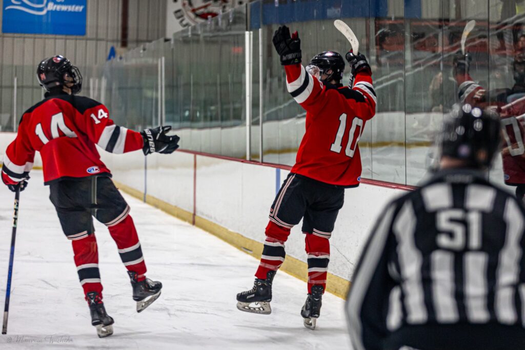 (PHOTO: Henry Bagley and Dean Kim celebrate a first period goal during the Rye Boys Varsity Hockey game versus Horace Greeley on Tuesday, February 20, 2024.)