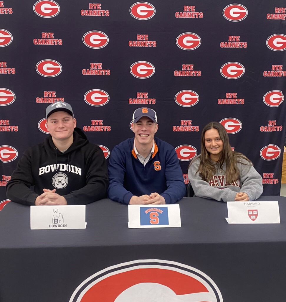 (PHOTO: Rye High School held a NLI (National Letter of Intent) signing ceremony on Wednesday, February 7, 2024. Three students have committed to their colleges and athletic programs (left to right): Charlie Saurack, Bowdoin College Football; AJ Miller Syracuse University Football; Ella Sheth Harvard University Crew.)