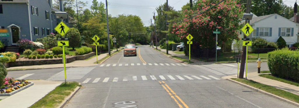 (PHOTO: Rectangular Rapid Flashing Beacons and signage striping installed at the intersection of Forest Avenue and Dearborn Avenue.)