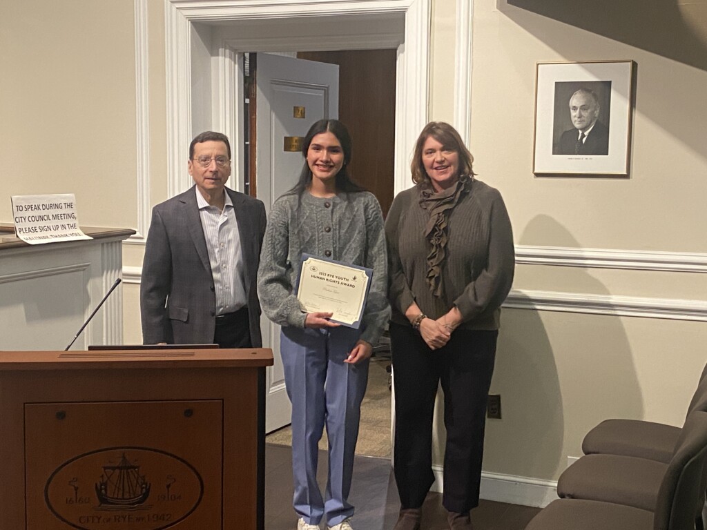 (PHOTO: Human Rights Commission Chair Rita Capek (far right) with Rye Mayor Josh Cohn and 2023 Human Rights Award youth winner Rye High School senior Paulina Tepan.)