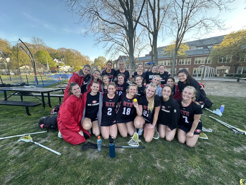 (PHOTO: The 2024 Rye Girls Varsity Lacrosse team on Thursday, Aprilo 25, 2024 when Lilly Whaling crossed 200 career goals (ending with 201 after the game).)