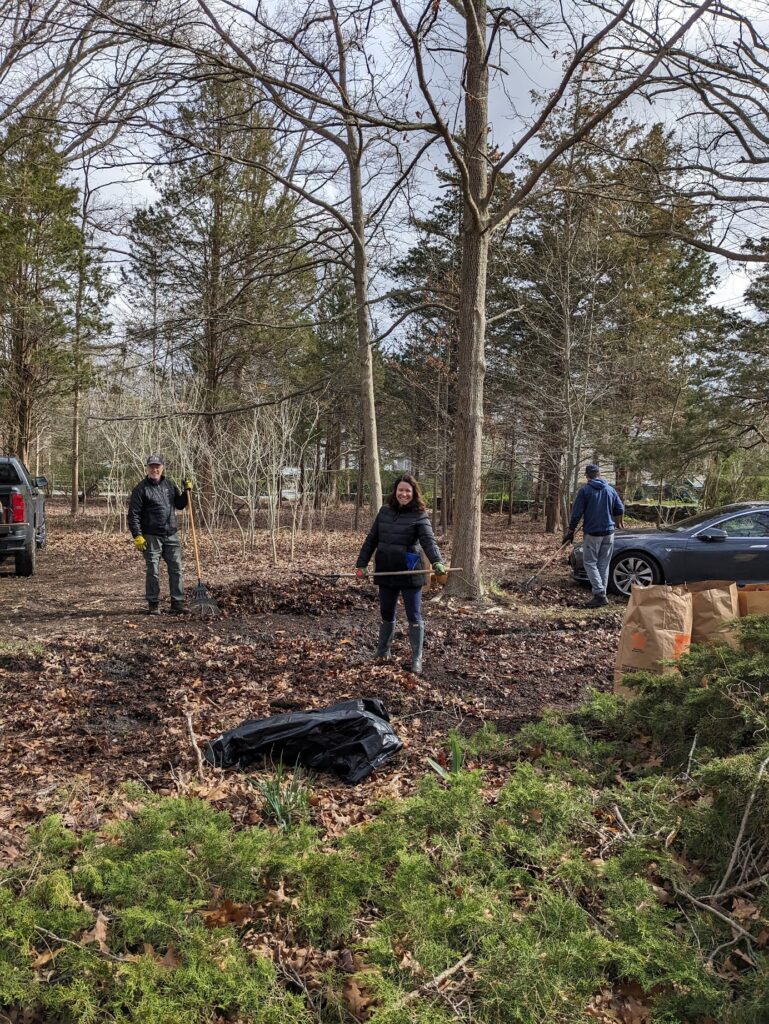 (PHOTO: Rye Sustainability Chair James Ward and Co-Chair Donna Providenti hand-raking the leaves and winter debris at the Bird Homestead & Meeting House Conservancy on April 13, 2024.)