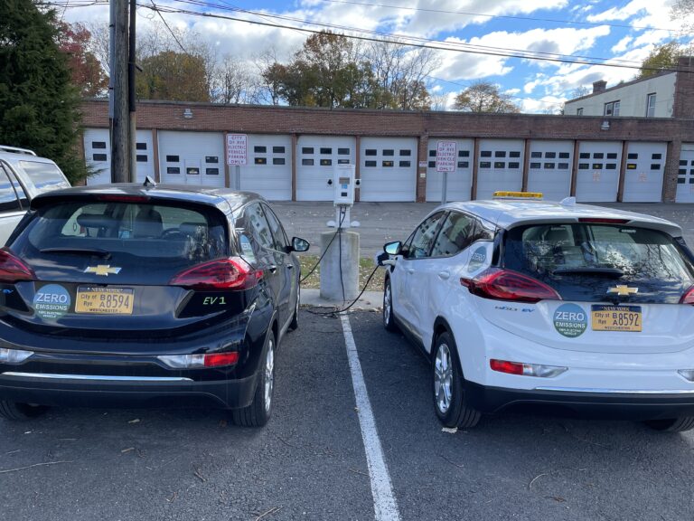 (PHOTO: Two of the City of Rye's electric vehicles at the DPW area in Disbrow Park.)