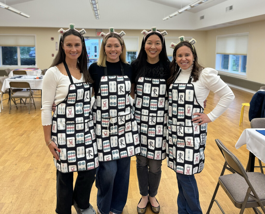 (PHOTO: At The Children's Philanthropy of Rye's Mahjong for a Cause!, fundraising chairs (left to right) Molly Pacala, Megan Pellarin (co-president), Liz Smith and Katie Finnegan pose before the games begin.)