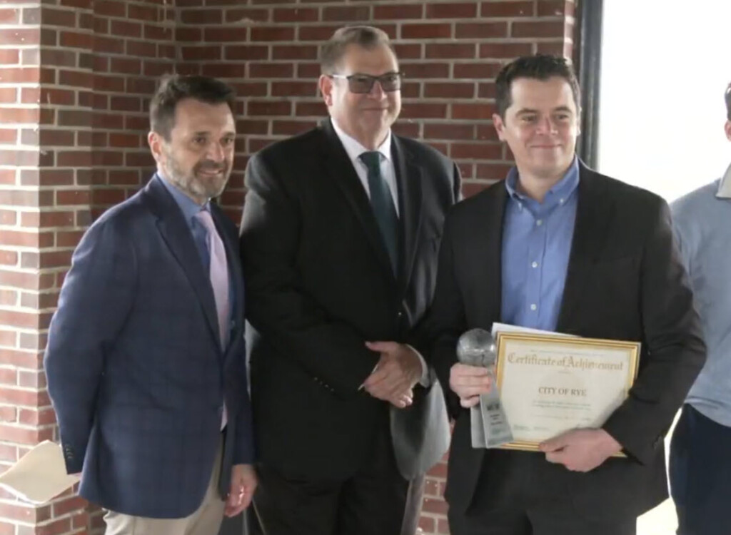 (PHOTO: Lou Vetrone, first deputy commissioner of the Westchester County’s Department of Environmental Facilities (DEF) and Vince Kopicki, the commissioner of the DEF, with the City of Rye's Assistant City Manager Brian Shea, who accepted the 2024 Eco Award for the City's high recycling rate in 2023 on Thursday, April 18, 2024.)