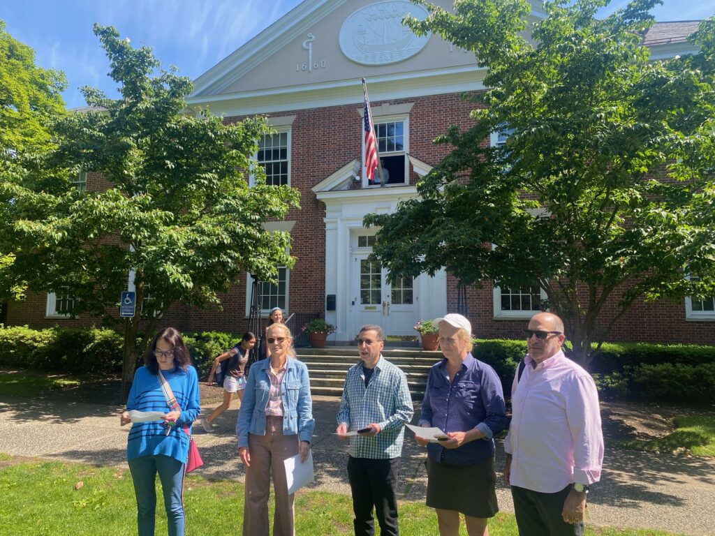 (PHOTO: Rye Mayor Josh Cohn (center) and some council members assembled on Friday afternoon, May 31, 2024 as the Pride flag was raised above Rye City Hall.)