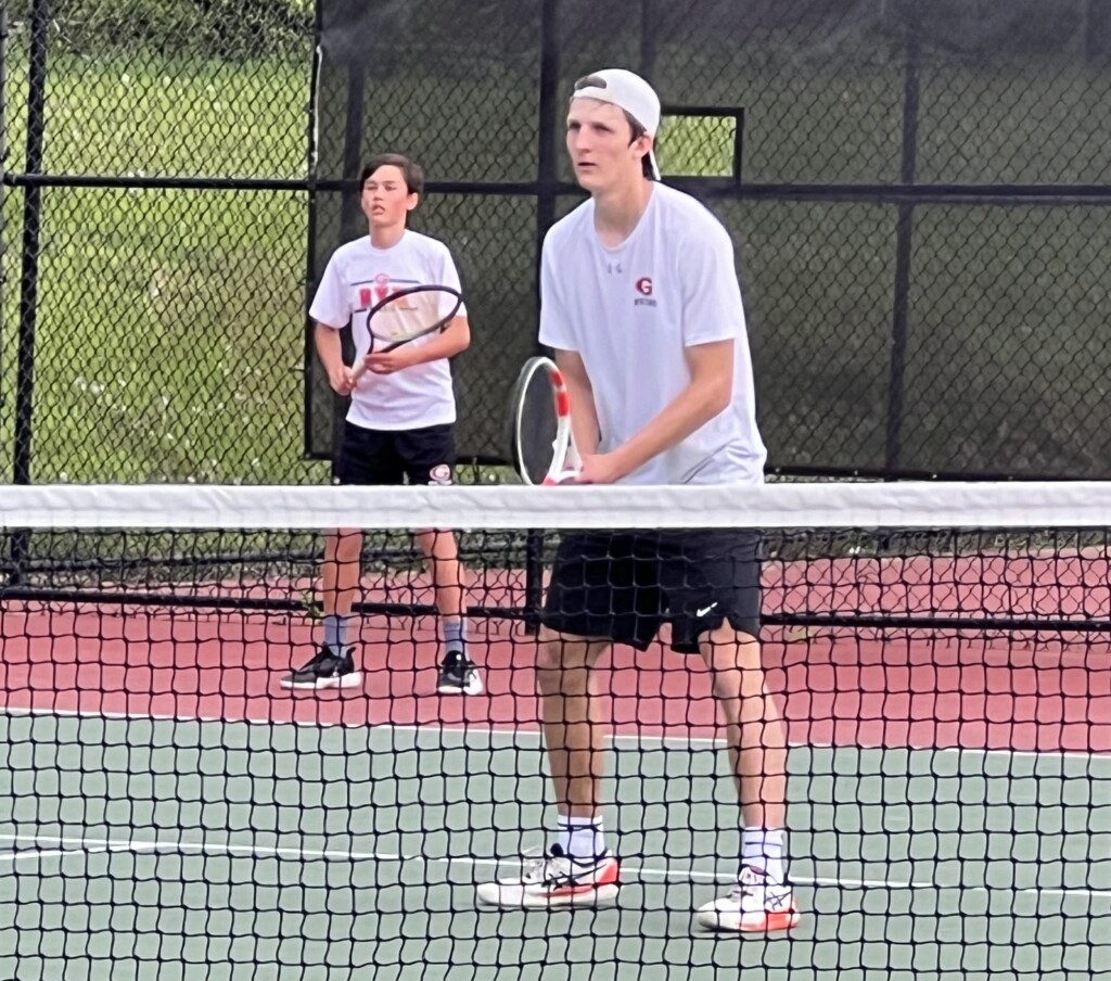 (PHOTO: Rye Boys Varsity Tennis players Gunnar Wey (12) and Timothy Morell (8) during their 4th doubles win with two tiebreakers facing Byram Hills on Monday, May 6, 2024.)