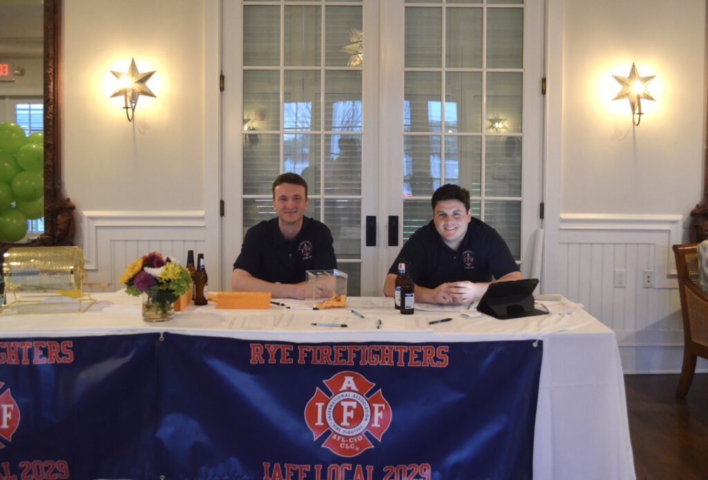 (PHOTO: Aiden Ahearn and Tommy Junior welcome guests at the Rye FD’s 2029 Local's Cinco de Mayo celebration on May 4, 2024 at the Shenorock Shore Club. )