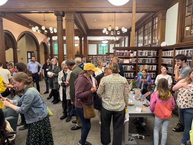 (PHOTO: Supporters of the 2024 Rye's Above public art installation gathered at the Rye Free Reading Room on Wednesday.)