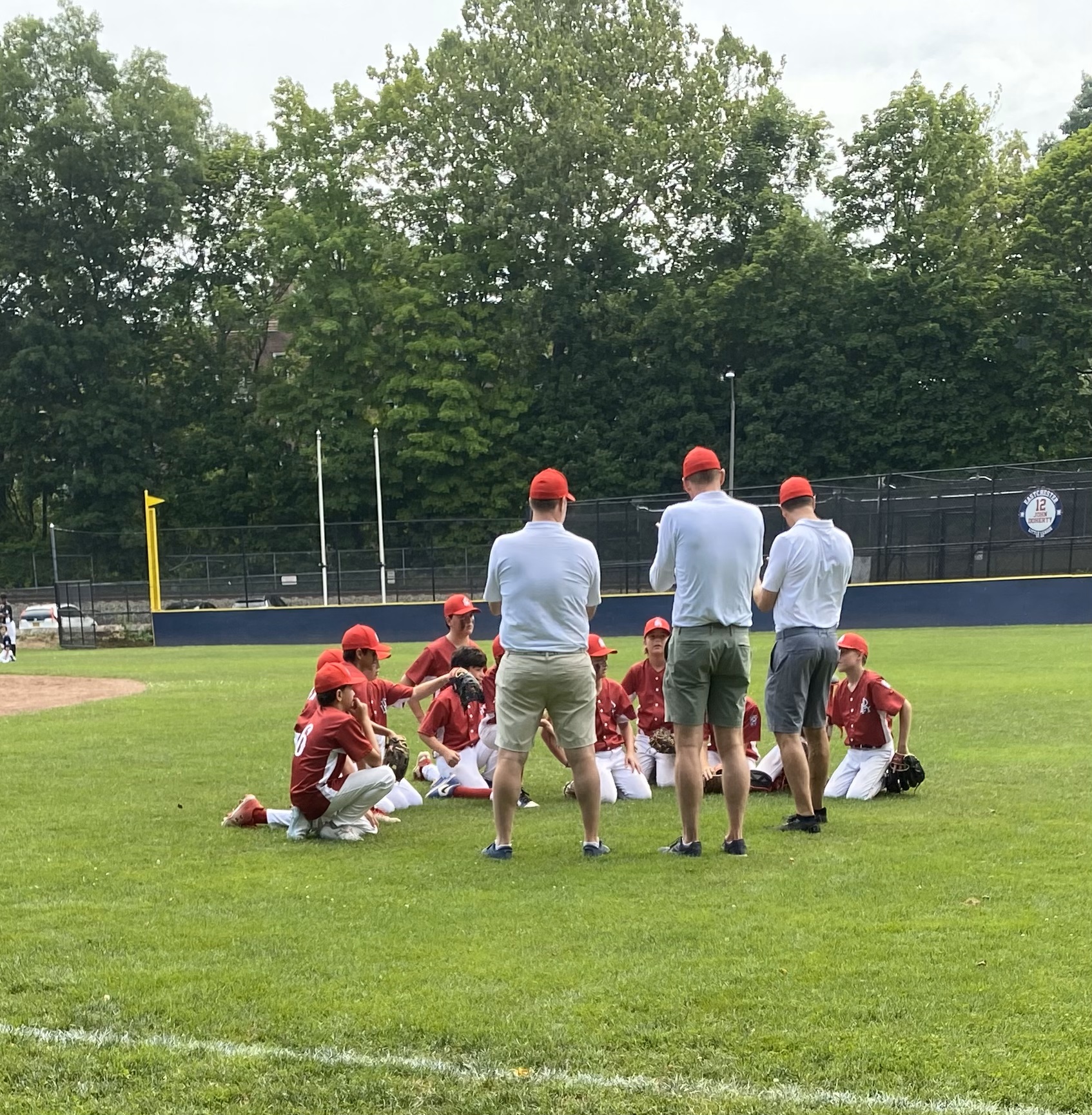 (PHOTO: The 12U Tournament Team huddles after defeating Eastchester 4-1. Their next game is tomorrow, Monday, at 5:30 against Harrison.)