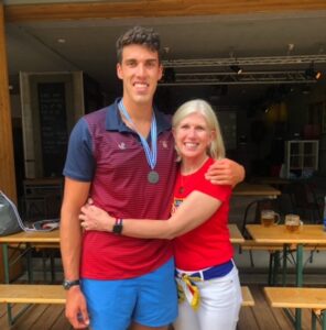 (PHOTO: Rodriguez with his mother Meg in Racice (outside Prague) for the 2021 U23 World Rowing Championships after the team won the silver medal.)
