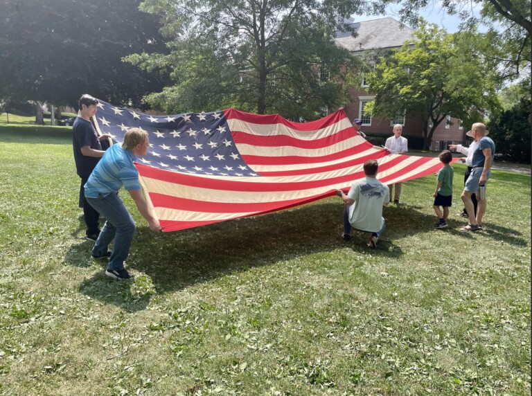 (PHOTO: The unfurling of the historic 48-star flag.)