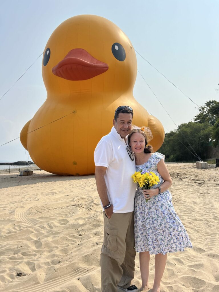 (PHOTO: Leo Lawrence (left) and Amy Wadford (right) renewed their wedding vowws in front of Mama Duck on Friday afternoon after a slight delay.)