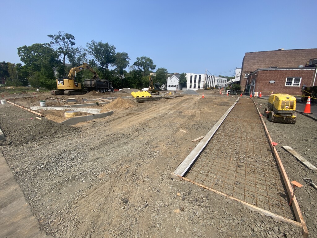 (PHOTO: The work to rebuild Parking Lot 1 just off Purchase Street in expected to be completed around Labor Day. It includes bioretention to filter stormwater before it enters the Blind Brook.)