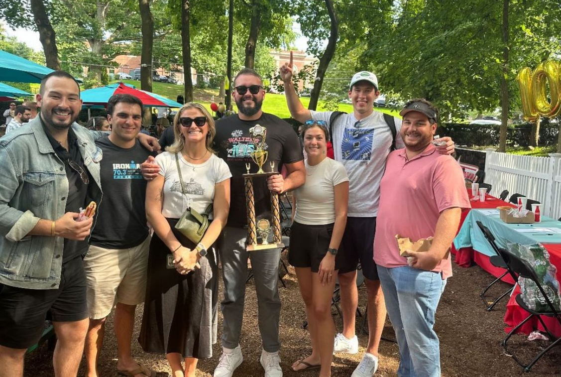 (PHOTO: With family, friends and fiancés: Colin Croughan, Ben Breitel, Christina Defelice, Walter's Hot Dog Eating Champion Will Croughan, Julia Buckley, Mark Croughan and Andrew Sackett.)