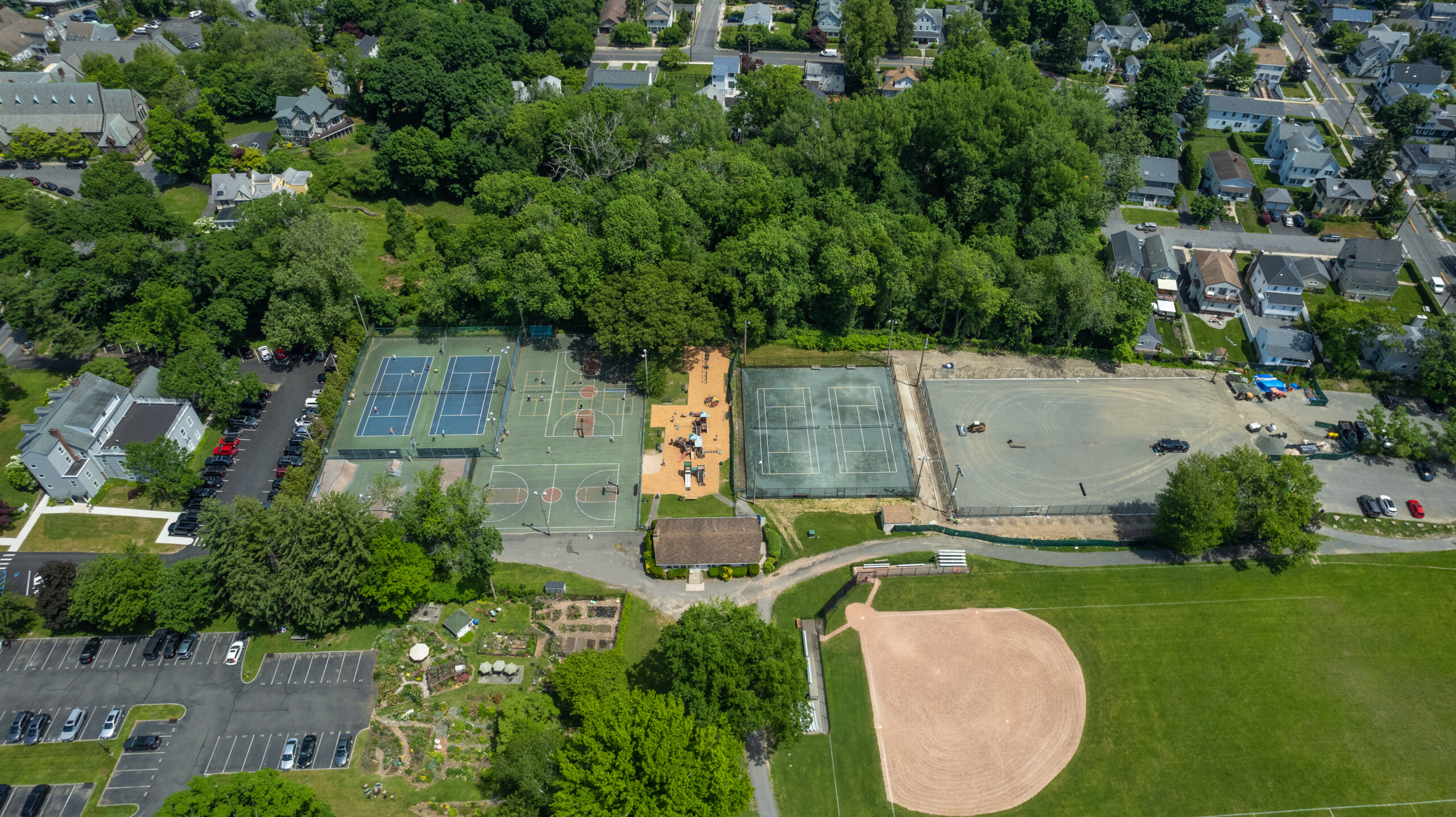 (PHOTO: The aerial photo of Rye Recreation from early June 2024 shows some of the construction (to the right) of the four new tennis hard courts. The courts were finished in late August. Credit: Alex Lee.)