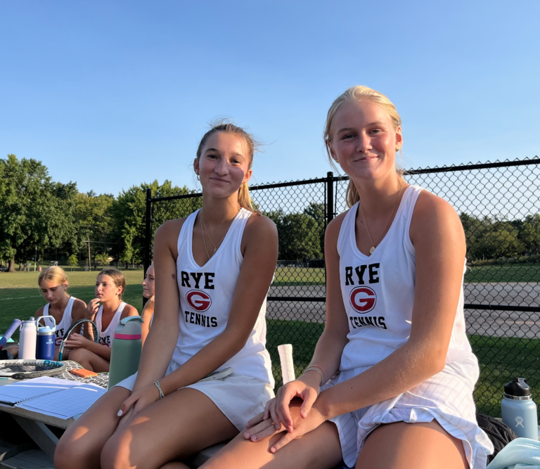 (PHOTO: Doubles partners Paloma Pepper (left) and Ella Poole (right) won their matchup in straight sets 6-e3. 6-0.)