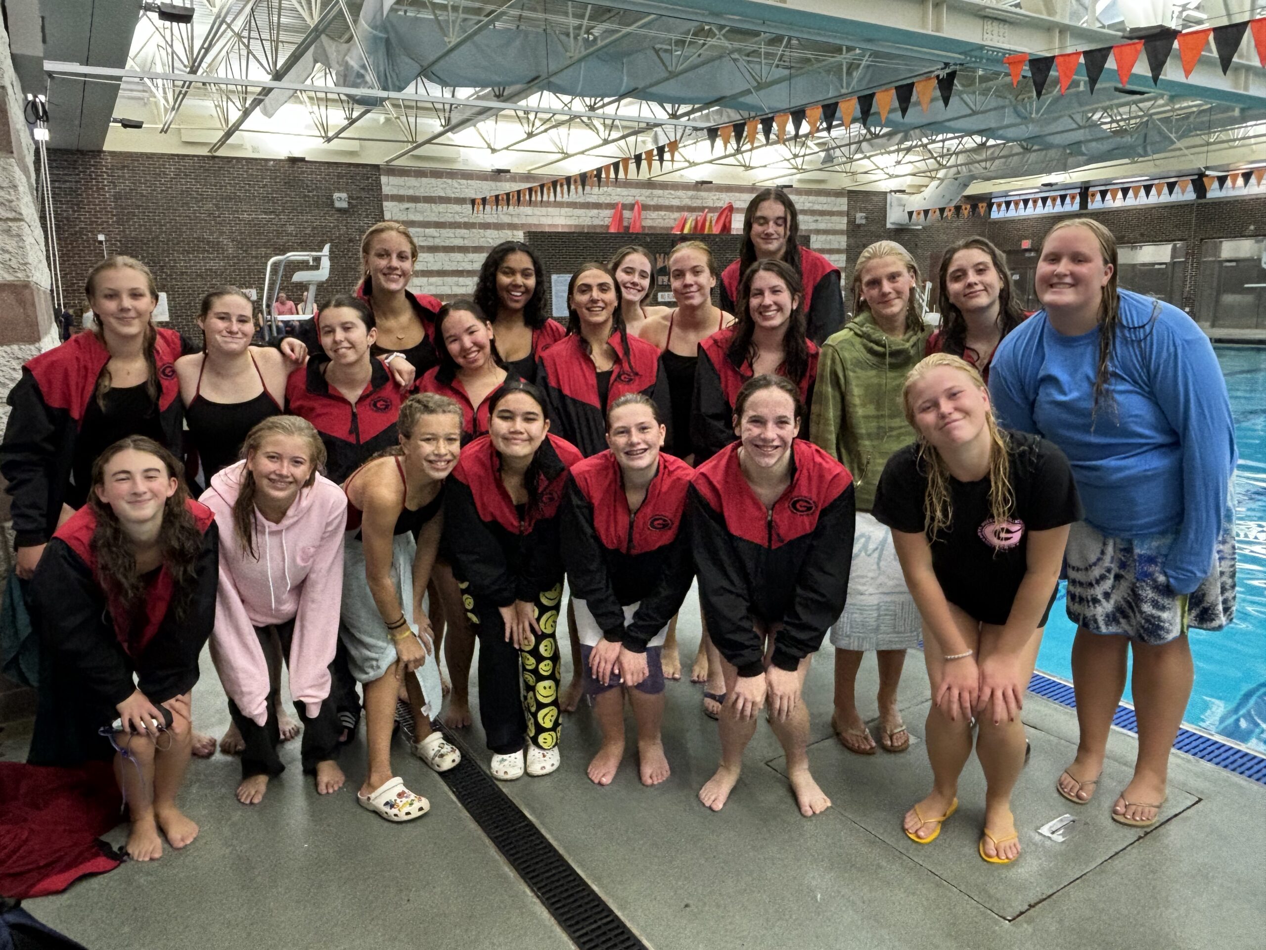 (PHOTO: Girls on the Rye - Rye Neck - Blind Brook Swimming and Diving Team pose after a huge victory against Eastchester on Friday.)