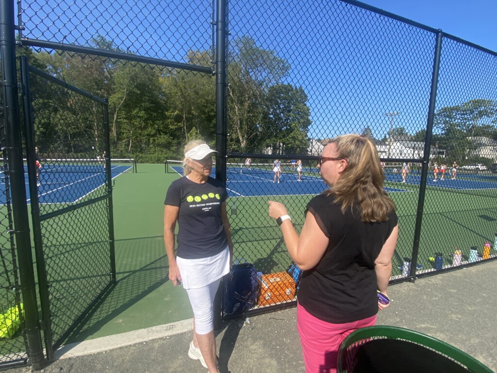 (PHOTO: Rye Recreation's four new tennis hard courts in "US Open" colors. Rye High School Varsity Boys and Girls Tennis Coach Ingrid Lopp spoke with Superintendent of Rye Recreation Erin Mantz about court scheduling.)