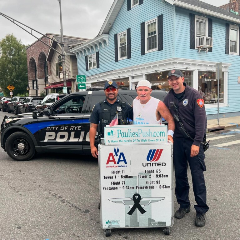 (PHOTO: Retired United Airlines flight attendant Paul “Paulie” Veneto walked through downtown Rye and the Boston Post Road today as part of "Paulie's Push" to honor those lost on 9-11. His fourth "push" Vento is walking from Boston to Ground Zero. Contributed: Rye PD.)