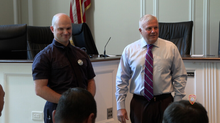 (PHOTO: Tyler Conway was sworn in as the newest Rye FD firefighter in a City Hall ceremony on Tuesday, September 3, 2024. Conway shown here with Public Safety Commissioner Mike Kopy. Contributed: Rye FD.)