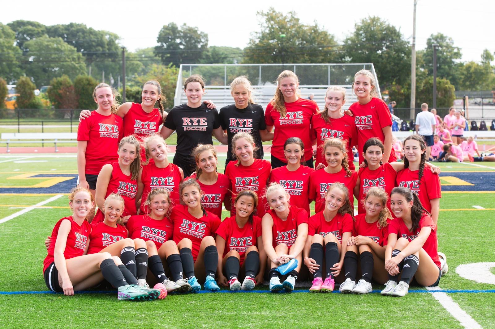 (PHOTO: The Girls Varsity Soccer Team poses following its 3-0 win in its season opener on September 7.)