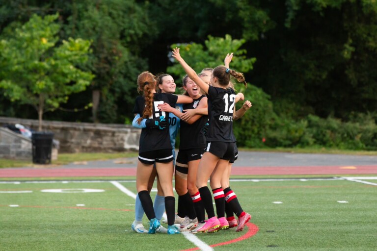 PHOTO: Girls Varsity Soccer celebrate their win against Harrison.