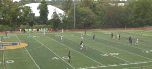 PHOTO: The Varsity Boys Soccer team secured a win despite rainy conditions.