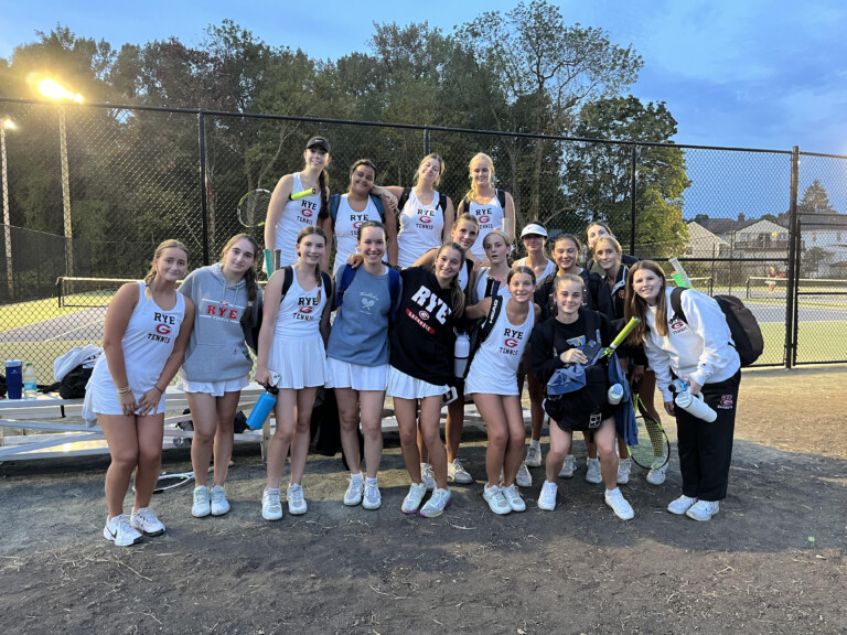 PHOTO: Rye Girls gather for a photo in celebration of a win under the new lights at the Rye Rec courts.