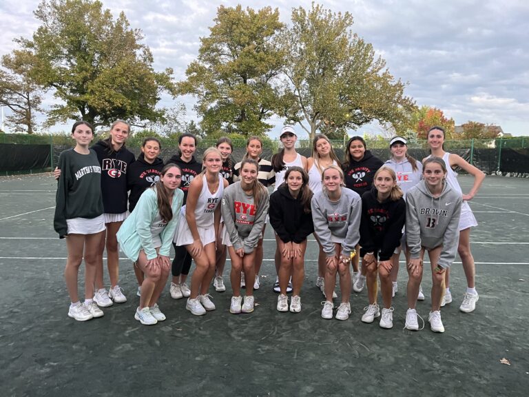 (PHOTO: The Rye Girls Varsity Tennis Team poses for a group photo after the victory and senior night festivities.)