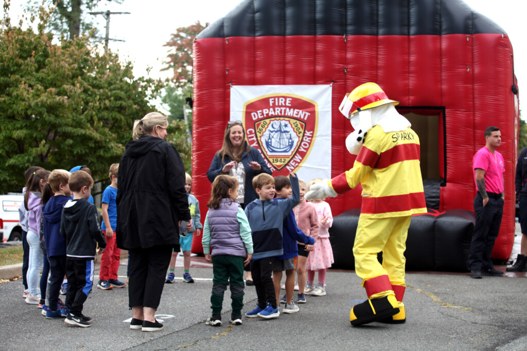 (PHOTO: Rye FD held and open house on Sunday, October 6, 2024 during fire prevention week.  The event featured a new inflatable safety house and a Sparky the Fire Dog mascot. Contributed.)