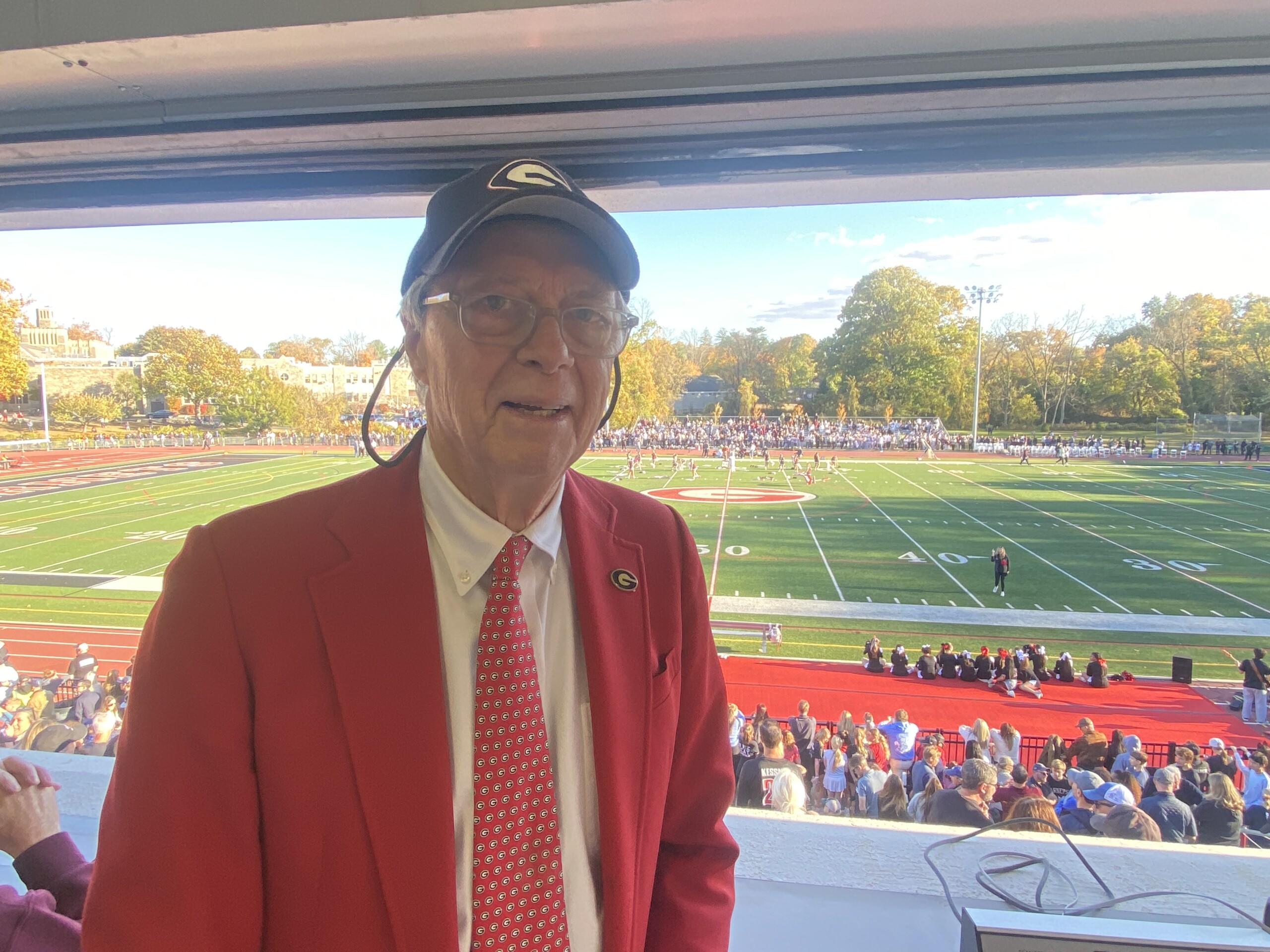 (PHOTO: The voice of Rye Garnet Football and Old Garnet Steve Feeney in the Nugent Stadium press box for the Rye - Harrison game on Saturday, October 26, 2024.)